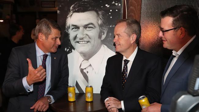 Former Victorian Premier Steve Bracks, Opposition Leader Bill Shorten and Victorian Premier Daniel Andrews having a Hawke's Patio Pale Beer at the John Curtin Hotel in Melbourne to honour Bob Hawke who passed away on Thursday. The pub was one of Hawke’s favourite watering holes. Picture Kym Smith