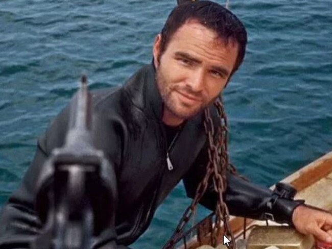 Burt Reynolds on the set of the woeful 1969 film Shark! The film was renamed for promotional purposes after a stuntman was mauled to death by a shark on camera.