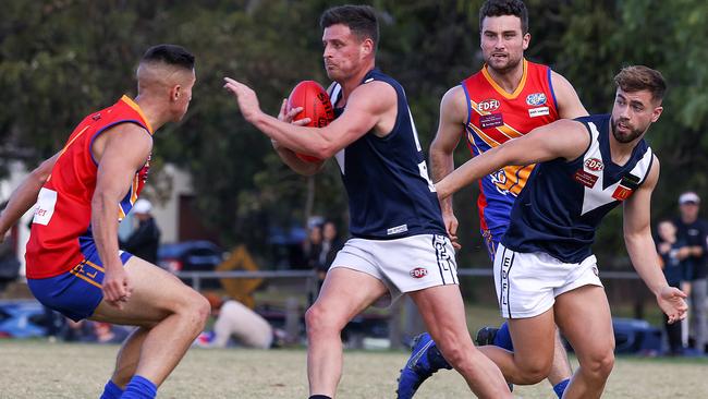 Avondale Heights stand-in skipper Justin Morris looks to take on a Maribyrnong Park opponent. Picture: Ian Currie