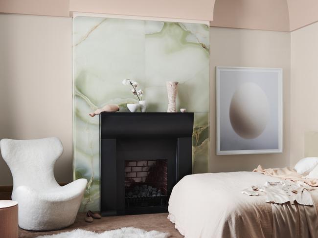 This chimney breast that looks like a slab of jade is the perfect foil for the wall in Dulux Shetland Lace Half and the ceiling in Pinkham. Styling: Bree Leech. Picture: Lisa Cohen.