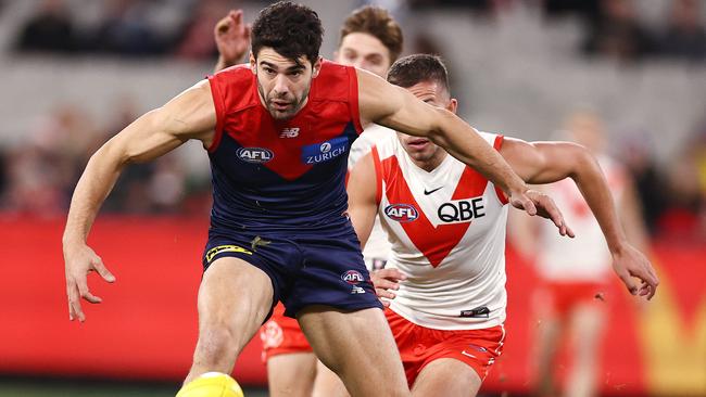 Christian Petracca of the Demons soccers the ball forward. Photo by Michael Klein