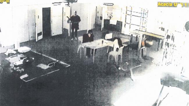 An artist-enhanced version of a CCTV still showing Matthew Johnson standing behind Carl Williams before he bludgeoned him to death. Picture: Supplied