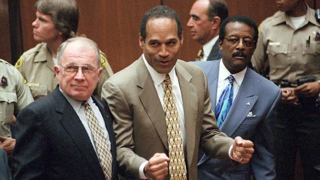 O.J. Simpson celebrates the not guilty verdict in the trial for the murder of his ex-wife Nicole Brown Simpson and her friend Ron Goldman in 1995