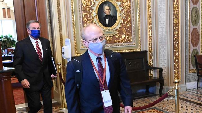 Donald Trump's defence team members David Schoen (C) and Michael van der Veen (L) in the Senate Reception Room of the US Capitol during a break in proceedings. Picture: AFP.