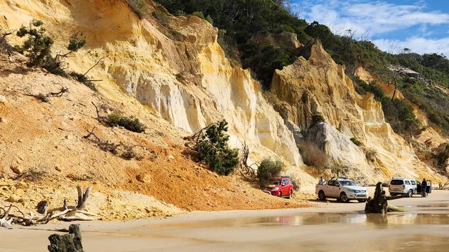 The sand slid on to cars parked along the beach south of Rainbow Beach, with tour operator Tyron Van Santen saying one man had to move fast to get out of its way.