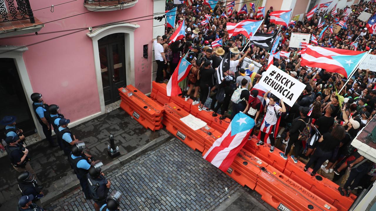 Protesters demonstrated near a police barricade on a street that leads to the governor’s mansion in Old San Juan. Picture: Getty
