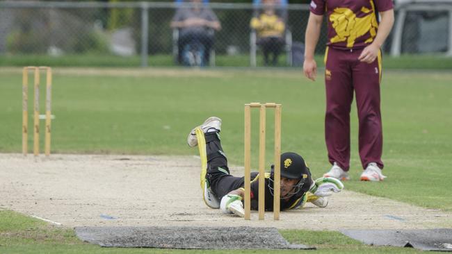 Shobit Singh dives to make his ground for Richmond. Picture: Valeriu Campan