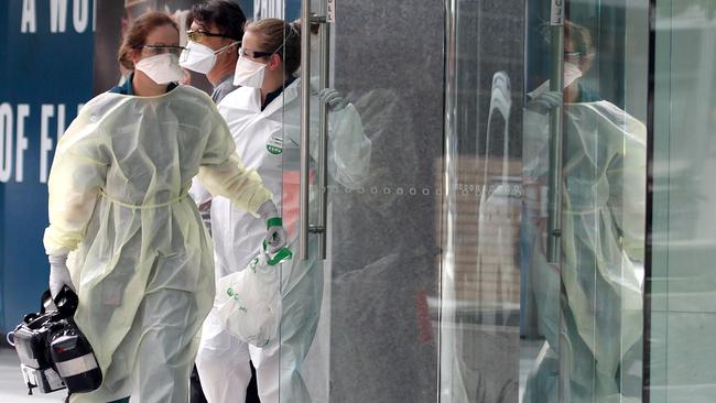 Paramedics and police at the Oracle building in Broadbeach on Tuesday. Picture: Mega Agency.