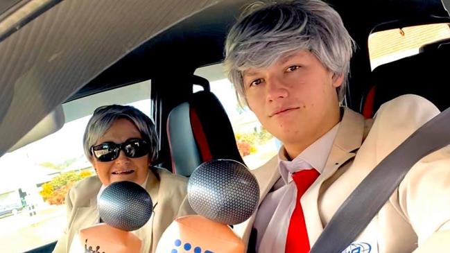 Charlie Mclennan and her son George dress up as Richie Benaud's at their Covid test. Credit: Facebook