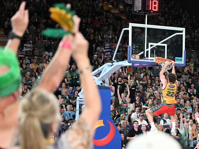 Will Magnay gets up for this epic dunk as Jackjumpers celebrate. Picture: Getty Images