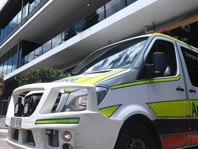 BRISBANE, AUSTRALIA - NewsWire Photos - JANUARY 13, 2021.An Ambulance leaves the Hotel Grand Chancellor in Spring Hill, Brisbane. Guests will be evacuated after six people linked to the building tested positive to the highly-contagious UK variant of the coronavirus.Picture: NCA NewsWire / Dan Peled