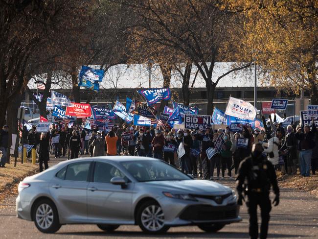 Trump supporters protest as Biden supporters gather to hear Democratic Presidential Candidate Joe Biden speak at a drive-in campaign event at the Minnesota State Fairgrounds in Saint Paul, Minnesota. Picture: AFP