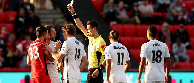 Apostolos Stamatelopoulos of Adelaide is given a yellow card, soon followed with a red, during the Round 24 A-League match against Wellington. Picture: AAP Image/James Elsby