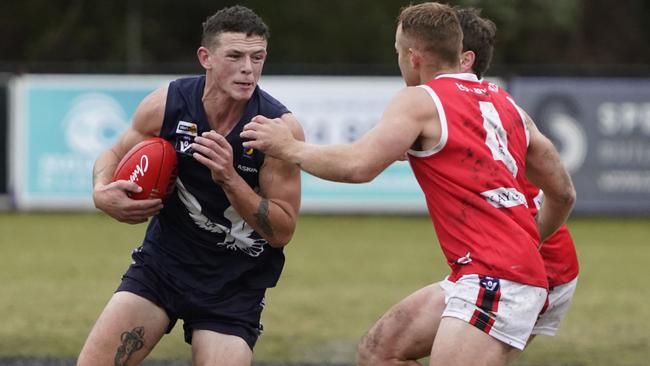 MPNFL: Edithvale-Aspendale’s Nick Carlon takes on the tacklers. Picture: Valeriu Campan