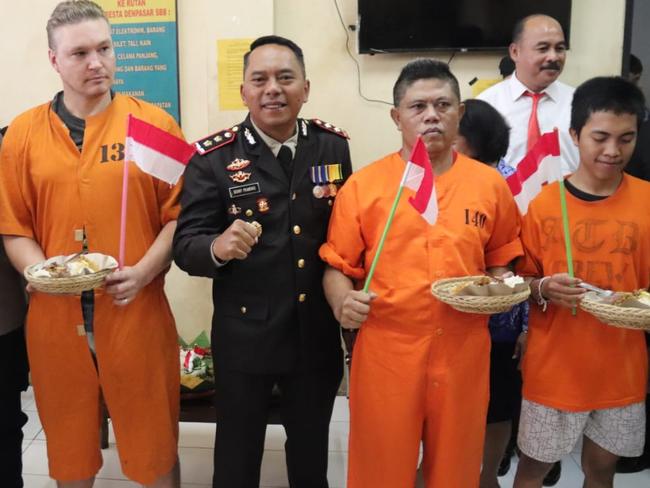 Australian David Van Iersel joins other detainees celebrating Indonesia’s Independence day. He was arrested with his friend William Cabantog at Lost City nightclub in Canggu. Picture. Police Handout