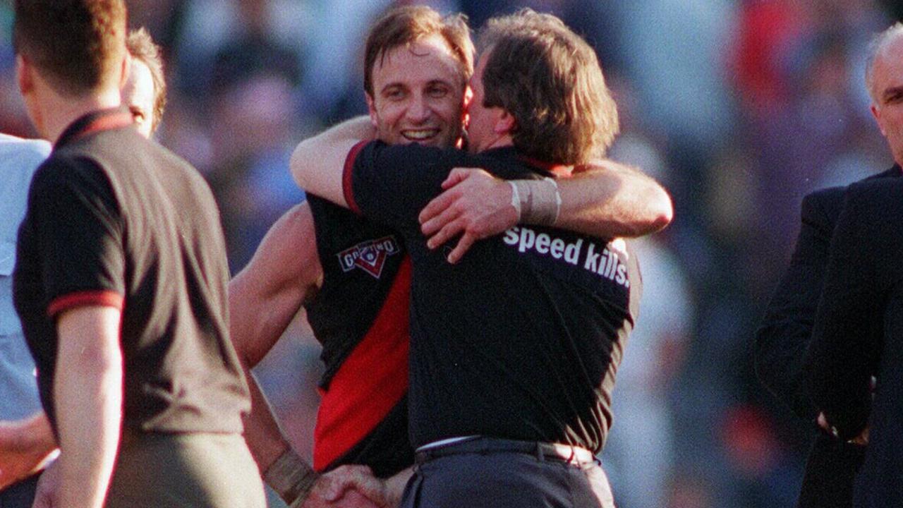 Coach Kevin Sheedy embraces Tim Watson after the 1993 grand final.