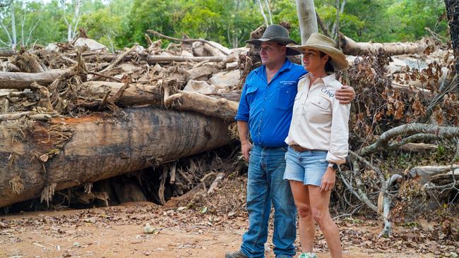 Caroline and Trevor Crisp inspecting the giant trees and boulders washed down by floodwater at Paluma Range.