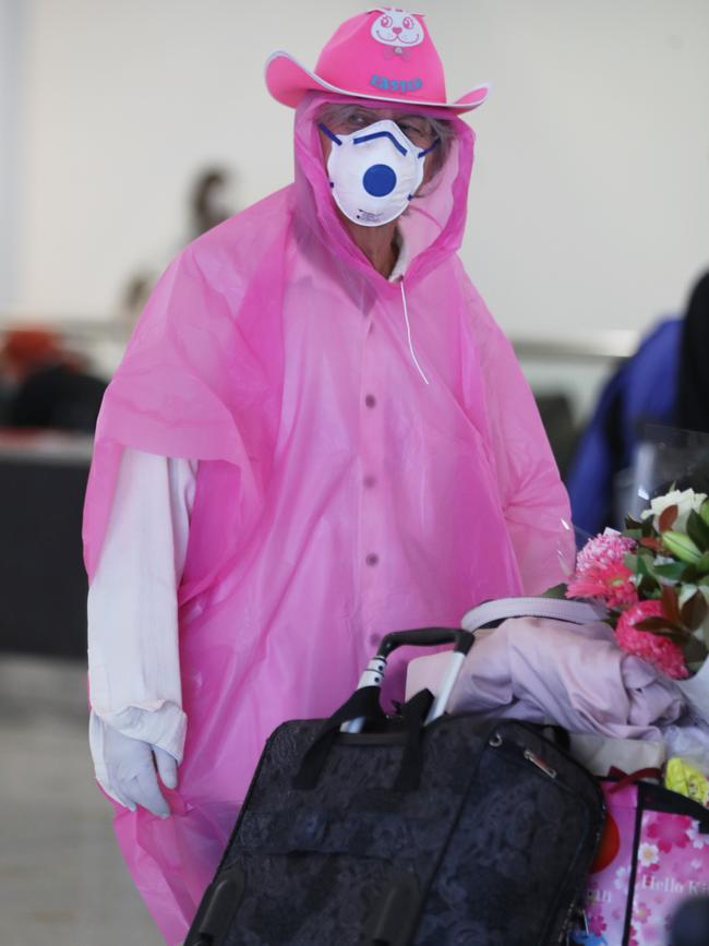 Some people at the Sydney international airport are taking precautions very seriously. Picture John Grainger