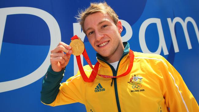 Matthew Mitcham parades his gold medal at the Beijing Olympics. Picture: Adam Head