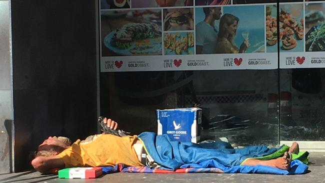 Surfers Paradise traders say this homeless man has been sleeping rough in central Surfers Paradise on party strip Orchid Avenue for months — and want urgent help to move him on.