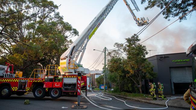 Firefighters battle the fire on Margate St, Botany. Picture: Damian Hofmann