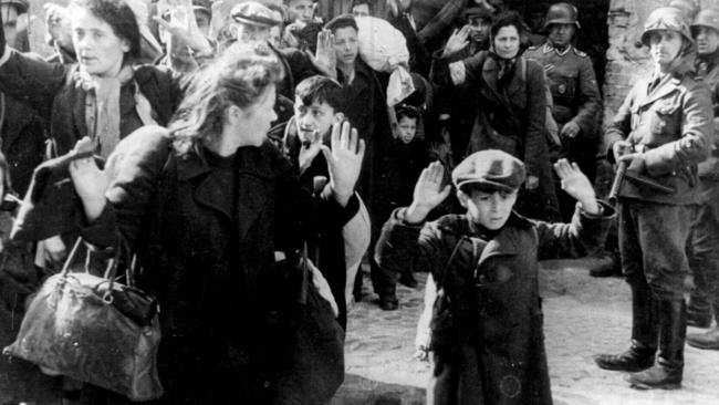 German Army troops leading Polish Jewish civilians from Warsaw ghetto in Poland to execution during World War II. holocaust jews two WWII historical/World/War/1939/45/Jews