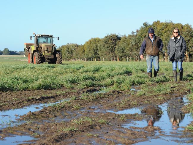 Tim Whitehead and his wife Bindi on their sodden property near Hawkesdale in the Western Districts. Picture Judy de Man