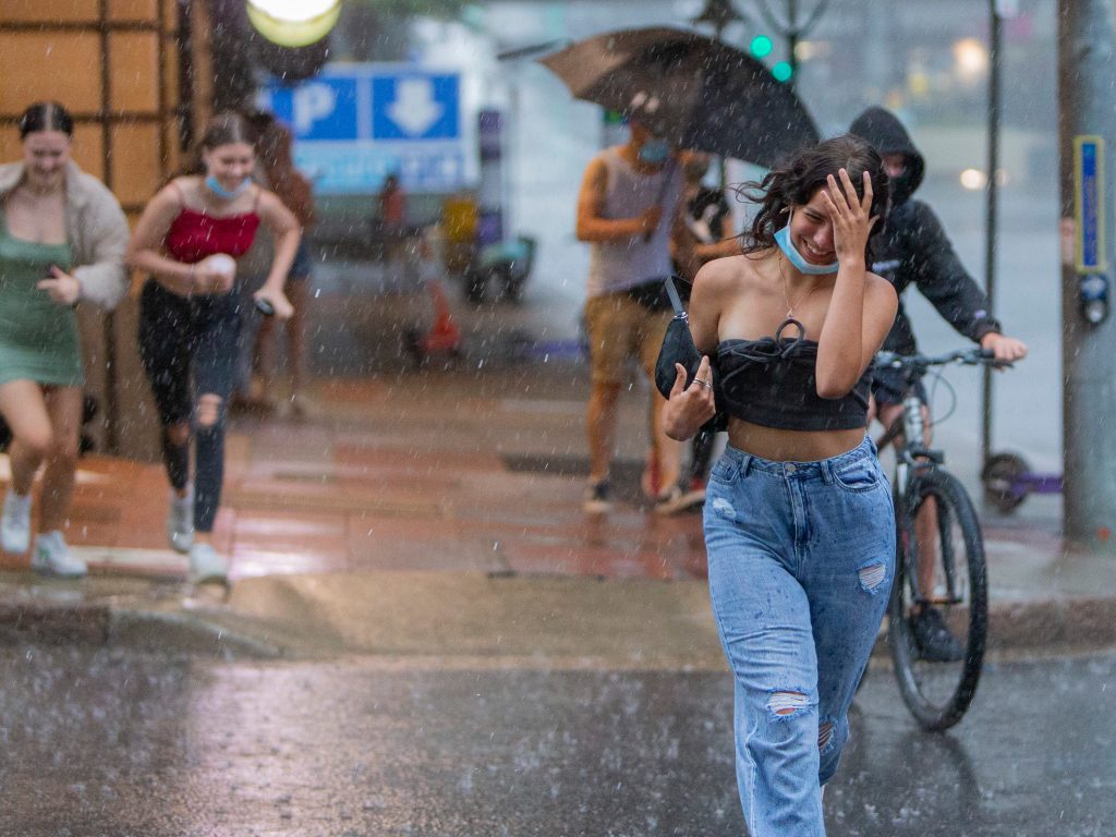 People  running for cover as a storm and rain hits the Brisbane CBD.  Picture: Jerad Williams