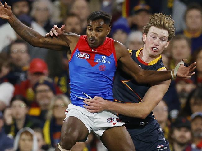 MELBOURNE , AUSTRALIA. April 4, 2024.  AFL Gather Round. Round 4.  Adelaide vs Melbourne at the Adelaide Oval.   Kysaiah Pickett of the Demons and Max Michalanney of the Crows during the 2nd qtr.    . Pic: Michael Klein