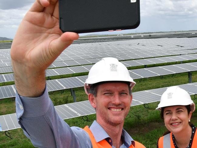 Minister for Main Roads, Road Safety and Ports and Minister for Energy, Biofuels and Water Supply, Mark Bailey (left), Queensland Premier Annastacia Palaszczuk (2nd from left), Wayne Stauton (2nd from right), Project Manager and the ALP candidate for Burdekin, Mike Brunker (right) are seen taking a selfie while inspecting the Clare Solar Farm project near the North Queensland town of Ayr during the Queensland Election campaign on Sunday, November 12, 2017. Premier Palaszczuk announced if re-elected her government would commit $151.6 million to the expansion of large scale renewable energy generation. (AAP Image / Darren England) NO ARCHIVING