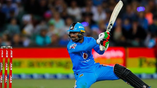 CRACKING SHOT: Strikers star Rashid Khan smashes an unconventional boundary against Sydney Thunder. Picture: DANIEL KALISZ (Getty Images).