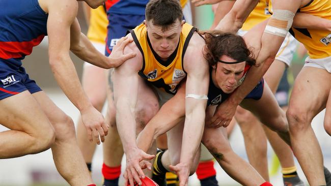 Coburg’s Marcus Lentini in customary position — battling for possession at the bottom of a pack against Werribee. Picture: Getty Images.