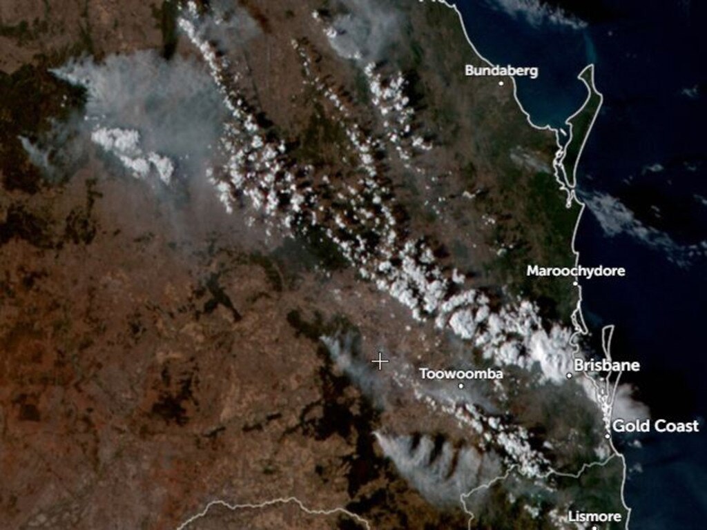 Smoke from the Tara (near the cross) and Millmerran (below the cross) fires west of Toowoomba can be seen drifting over a large swath of South East Queensland, with multiple others to the west of Bundaberg.