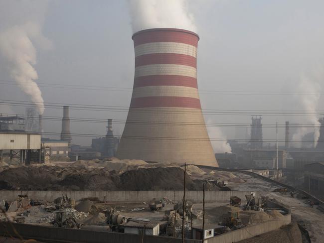 Smoke and steam spew from the sprawling complex that is a part of the Jiujiang steel and rolling mills in Qianan in northern China's Hebei province. Picture: AP