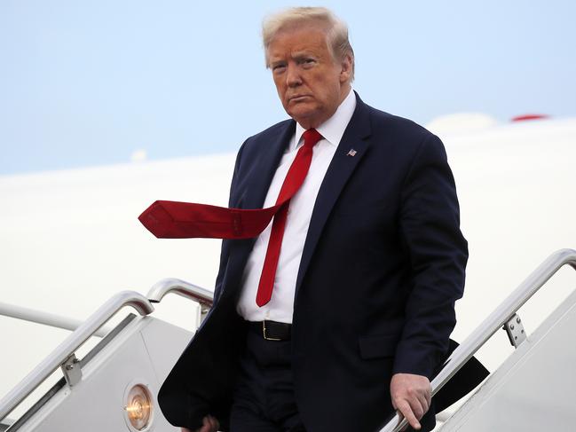 President Donald Trump departs from air force One.