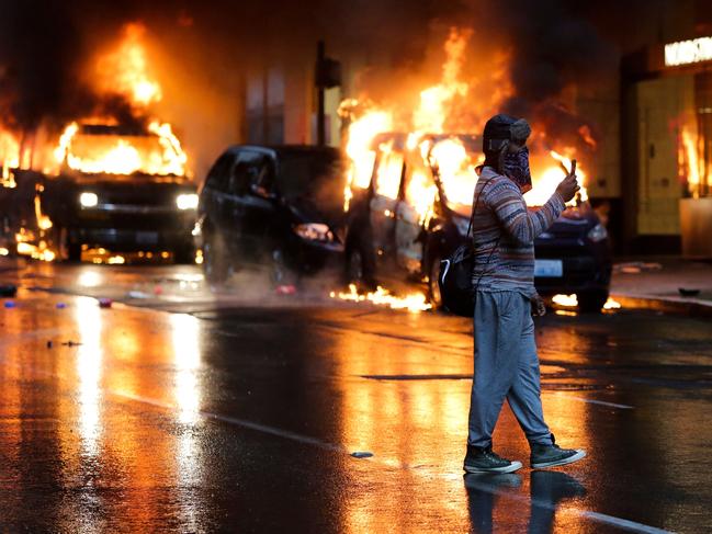 Burning cars seen during the 2020 George Floyd riots. Picture: Jason Redmond/AFP