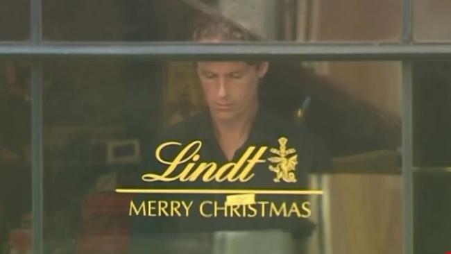 Lindt cafe siege victim Tori Johnson at the window of the Cafe just hours before he was executed by gunman Man Haron Monis. Picture: Channel 7.