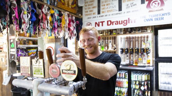 Barman Simon West pours a cold one at the Daly Waters Historic Pub. Picture: Floss Adams.