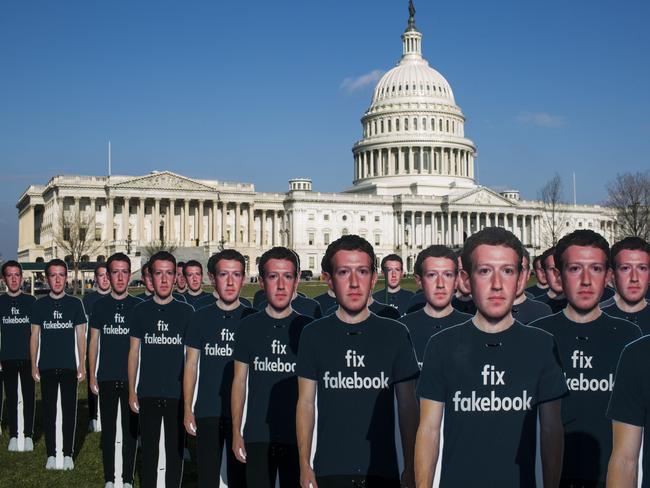 About 100 life-size cutouts of Facebook CEO Mark Zuckerberg sit on the lawn of the U.S. Capitol. Picture: Getty