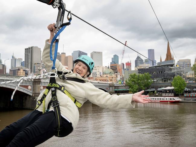 Lorna Montgomery, 92, flying over the Yarra on the zip line. Picture: Tony Gough