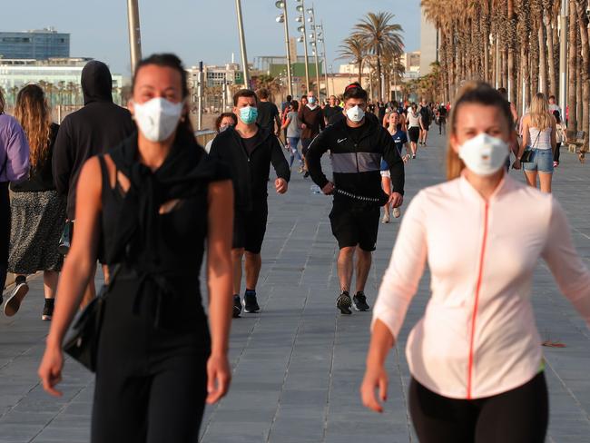 People exercise along an esplanade in Barcelona during the hours allowed by the government to exercise. Picture: AFP