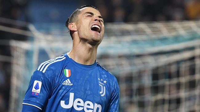 Juventus' Portuguese forward Cristiano Ronaldo reacts after missing a goal opportunity during the Italian Serie A football match SPAL vs Juventus on February 22, 2020 at the Paolo-Mazza stadium in Ferrara. (Photo by Isabella BONOTTO / AFP)