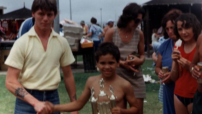 Mundine with his coach after they won Zetland Juniors Under 7s.