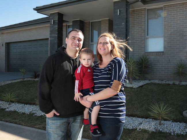 Oran Park’s Matthew El-Akl, wife Julia and son Raphael-Matteo would love to see rail come to their suburb. Picture: Robert Pozo