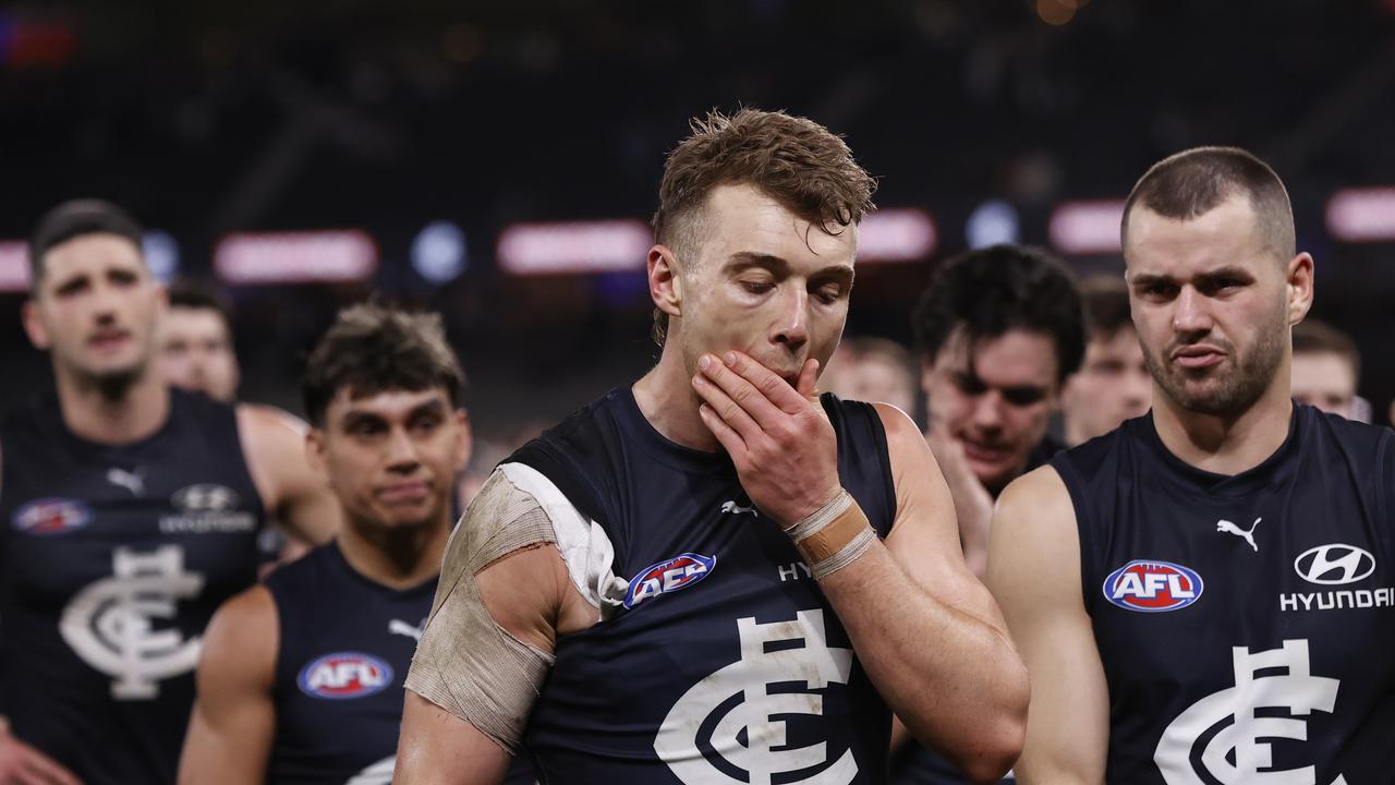 MELBOURNE, AUSTRALIA - JULY 26: Dejected Carlton players walk from the ground after the round 20AFL match between Carlton Blues and Port Adelaide Power at Marvel Stadium, on July 26, 2024, in Melbourne, Australia. (Photo by Darrian Traynor/Getty Images via AFL Photos)