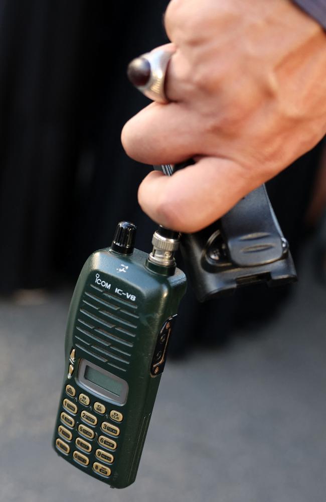 A man holds a walkie talkie device after he removed the battery during the funeral of persons killed when hundreds of paging devices exploded in a deadly wave across Lebanon. Picture: AFP