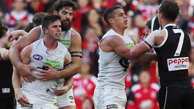 Levi Casboult holds an angry Marc Murphy on Saturday. Picture: Michael Klein