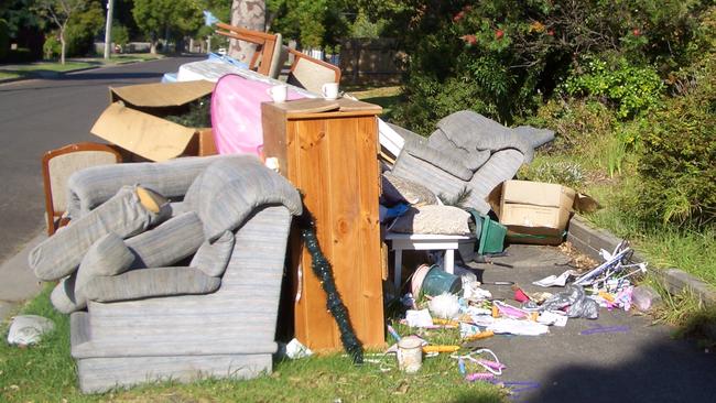 The Ferntree Gully rubbish pile spilt over on the footpath, obstructing pedestrians.