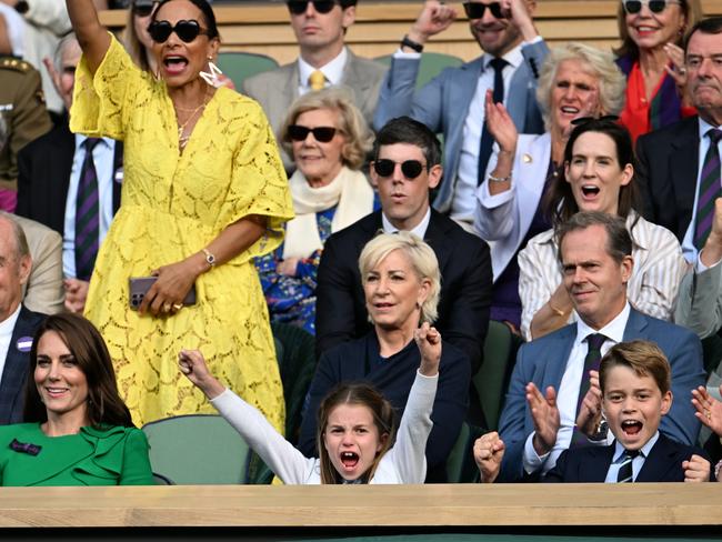 As Carlos Alcaraz defeats Novak Djokovic for the Wimbledon title, Princess Charlotte and Prince George punch the air and cheer alongside their mum Kate. Picture: Getty Images