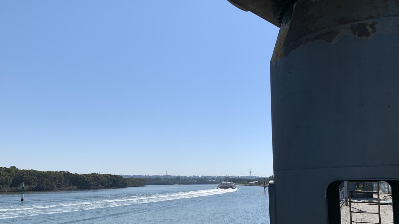 The Sydney to Parramatta Rivercat rumbles past the still in situ cranes of the former RANAD Newington. Pictures: Benedict Brook